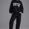 Pantaloni de jogging din jersey de bumbac moale, cu talie medie, în negru Pantaloni de jogging din jersey de bumbac moale, cu talie medie, în negru