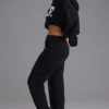 Pantaloni de jogging din jersey de bumbac moale, cu talie medie, în negru Pantaloni de jogging din jersey de bumbac moale, cu talie medie, în negru
