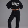 Pantaloni de jogging din jersey de bumbac moale, cu talie medie, în negru Pantaloni de jogging din jersey de bumbac moale, cu talie medie, în negru
