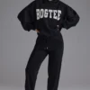 Pantaloni de jogging din jersey de bumbac moale, cu talie medie, în negru Pantaloni de jogging din jersey de bumbac moale, cu talie medie, în negru
