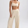 Pantaloni de jogging din material frotir cu croi larg, de culoare crem Pantaloni de jogging din material frotir cu croi larg, de culoare crem