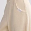 Pantaloni de jogging din material frotir cu croi larg, de culoare crem Pantaloni de jogging din material frotir cu croi larg, de culoare crem