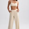 Pantaloni de jogging din material frotir cu croi larg, de culoare crem Pantaloni de jogging din material frotir cu croi larg, de culoare crem