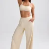 Pantaloni de jogging din material frotir cu croi larg, de culoare crem Pantaloni de jogging din material frotir cu croi larg, de culoare crem