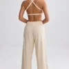 Pantaloni de jogging din material frotir cu croi larg, de culoare crem Pantaloni de jogging din material frotir cu croi larg, de culoare crem