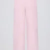 Pantaloni de jogging din tricot, cu talie medie și croi larg, în roz pal Pantaloni de jogging din tricot, cu talie medie și croi larg, în roz pal