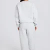 Pantaloni de jogging relaxați, cu talie medie, din jersey de bumbac periat, în gri melanj Pantaloni de jogging relaxați, cu talie medie, din jersey de bumbac periat, în gri melanj