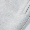 Pantaloni de jogging relaxați, cu talie medie, din jersey de bumbac periat, în gri melanj Pantaloni de jogging relaxați, cu talie medie, din jersey de bumbac periat, în gri melanj