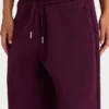 Pantaloni de jogging relaxați din jersey de bumbac periat, cu talie medie, în culoarea burgund Pantaloni de jogging relaxați din jersey de bumbac periat, cu talie medie, în culoarea burgund