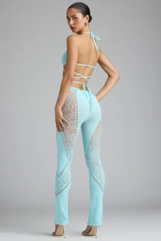 Pantaloni evazați cu talie medie și ornamente Stevie, în culoarea albastru gheață