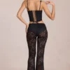 Pantaloni evazați din dantelă transparentă, cu talie medie, model Calista, negri Pantaloni evazați din dantelă transparentă, cu talie medie, model Calista, negri
