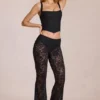 Pantaloni evazați din dantelă transparentă, cu talie medie, model Calista, negri Pantaloni evazați din dantelă transparentă, cu talie medie, model Calista, negri