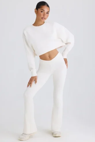 Pantaloni evazați din jersey de bumbac texturat, de culoare albă Pantaloni evazați din jersey de bumbac texturat, de culoare albă