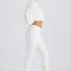 Pantaloni evazați din jersey de bumbac texturat, de culoare albă Pantaloni evazați din jersey de bumbac texturat, de culoare albă