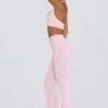 Pantaloni evazați din jersey periat, cu volane, în nuanța roz pal melanj Pantaloni evazați din jersey periat, cu volane, în nuanța roz pal melanj
