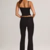 Pantaloni evazați Patsy Modal cu talie medie, negri