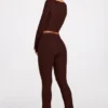 Pantaloni evazați Philippa din modal, cu talie medie, în culoarea ciocolată Pantaloni evazați Philippa din modal, cu talie medie, în culoarea ciocolată