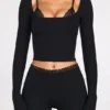 Pantaloni evazați Philippa din modal, cu talie medie, în culoarea neagră Pantaloni evazați Philippa din modal, cu talie medie, în culoarea neagră