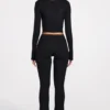 Pantaloni evazați Philippa din modal, cu talie medie, în culoarea neagră Pantaloni evazați Philippa din modal, cu talie medie, în culoarea neagră