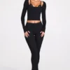 Pantaloni evazați Philippa din modal, cu talie medie, în culoarea neagră Pantaloni evazați Philippa din modal, cu talie medie, în culoarea neagră