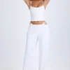 Pantaloni largi cu decupaje și curea Zaria, în culoarea alb