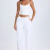 Pantaloni largi cu decupaje și curea Zaria, în culoarea alb