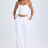 Pantaloni largi cu decupaje și curea Zaria, în culoarea alb
