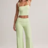 Pantaloni largi cu pliu Melida din modal, în culoarea verde salvie Pantaloni largi cu pliu Melida din modal, în culoarea verde salvie