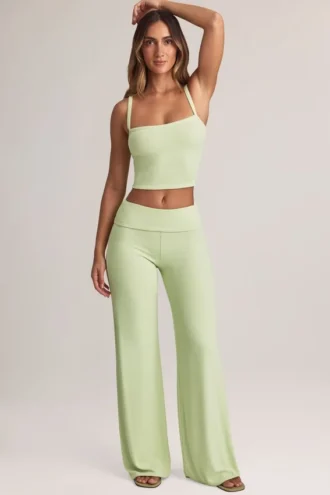 Pantaloni largi cu pliu Melida din modal, în culoarea verde salvie