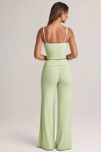 Pantaloni largi cu pliu Melida din modal, în culoarea verde salvie