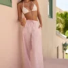 Pantaloni Piran din poplin de bumbac cu croi larg, cu dungi roz