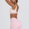 Pantaloni scurți mini cu volane în marl roz pal