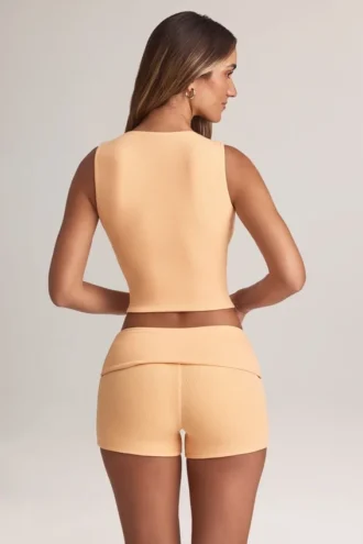 Pantaloni scurți Nina Modal cu talie medie și pliu, culoare piersică