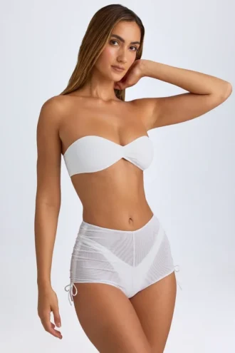 Pantaloni scurți transparenți cu volane Rocas, de culoare albă