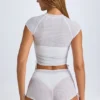Pantaloni scurți transparenți cu volane Rocas, de culoare albă