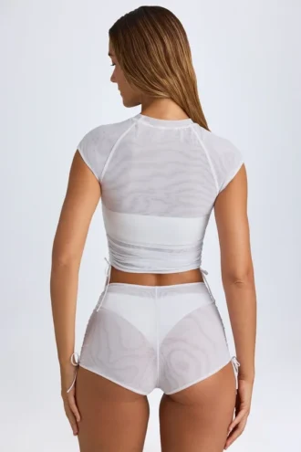 Pantaloni scurți transparenți cu volane Rocas, de culoare albă