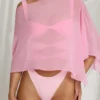 Poncho transparent Zarayah în roz bomboană Poncho transparent Zarayah în roz bomboană
