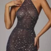 Rochie de seară Soraya cu guler înalt, transparentă și decorată, în culoarea bleumarin Rochie de seară Soraya cu guler înalt, transparentă și decorată, în culoarea bleumarin
