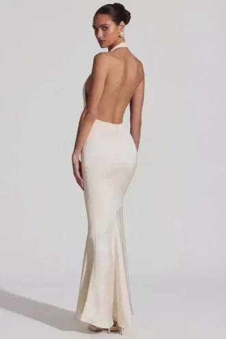 Rochie lungă Desiree cu spate decupat, gât halter și croi în formă de coadă de pește, în culoarea ivoriu Rochie lungă Desiree cu spate decupat, gât halter și croi în formă de coadă de pește, în culoarea ivoriu