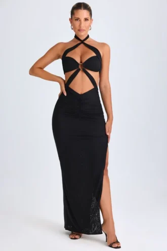 Rochie maxi Bethania cu decupaje și detalii metalice, cu gât halter, în culoarea neagră Rochie maxi Bethania cu decupaje și detalii metalice, cu gât halter, în culoarea neagră
