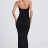 Rochie maxi Margot cu decupaje și detalii metalice, cu gât halter, în negru Rochie maxi Margot cu decupaje și detalii metalice, cu gât halter, în negru