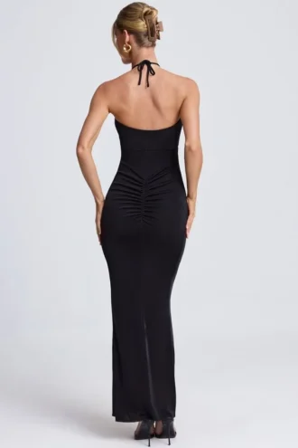 Rochie maxi Margot cu decupaje și detalii metalice, cu gât halter, în negru Rochie maxi Margot cu decupaje și detalii metalice, cu gât halter, în negru