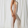 Rochie Maxi Pacifica cu decupaje și detalii din perle, în culoarea alb perlat Rochie Maxi Pacifica cu decupaje și detalii din perle, în culoarea alb perlat