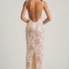 Rochie maxi Tavira cu decolteu rotund și spate decupat, decorată, în culoarea ivoriu Rochie maxi Tavira cu decolteu rotund și spate decupat, decorată, în culoarea ivoriu