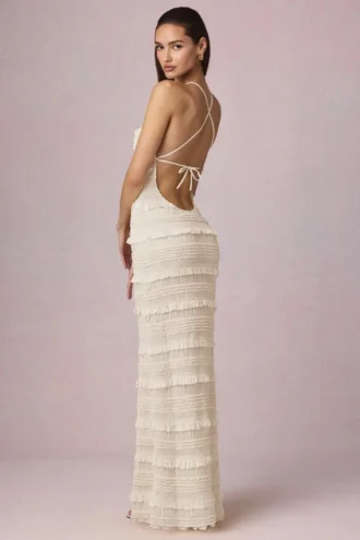 Rochie maxi Tove cu volane, fără spate și cu gât halter, în culoarea Ivory Rochie maxi Tove cu volane, fără spate și cu gât halter, în culoarea Ivory