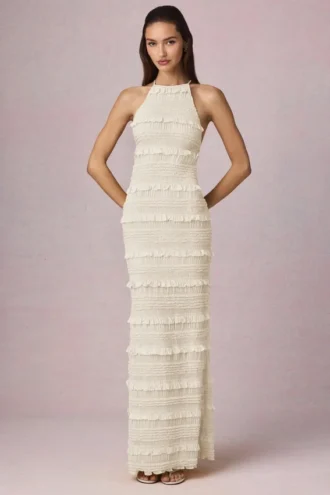 Rochie maxi Tove cu volane, fără spate și cu gât halter, în culoarea Ivory Rochie maxi Tove cu volane, fără spate și cu gât halter, în culoarea Ivory