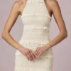 Rochie maxi Tove cu volane, fără spate și cu gât halter, în culoarea Ivory Rochie maxi Tove cu volane, fără spate și cu gât halter, în culoarea Ivory