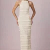 Rochie maxi Tove cu volane, fără spate și cu gât halter, în culoarea Ivory Rochie maxi Tove cu volane, fără spate și cu gât halter, în culoarea Ivory