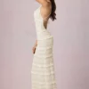 Rochie maxi Tove cu volane, fără spate și cu gât halter, în culoarea Ivory Rochie maxi Tove cu volane, fără spate și cu gât halter, în culoarea Ivory