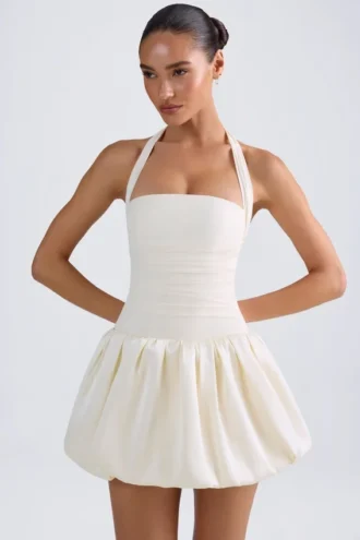 Rochie micro mini cu corset, cu decolteu în V și șnururi, cu tiv bufant, Ludmila, în culoarea Ivory Rochie micro mini cu corset, cu decolteu în V și șnururi, cu tiv bufant, Ludmila, în culoarea Ivory